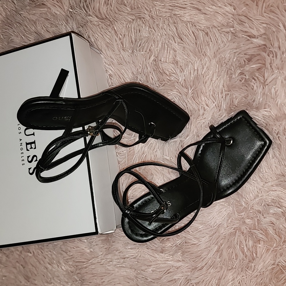 Women Black square toe heel sandals with ankle wrap.